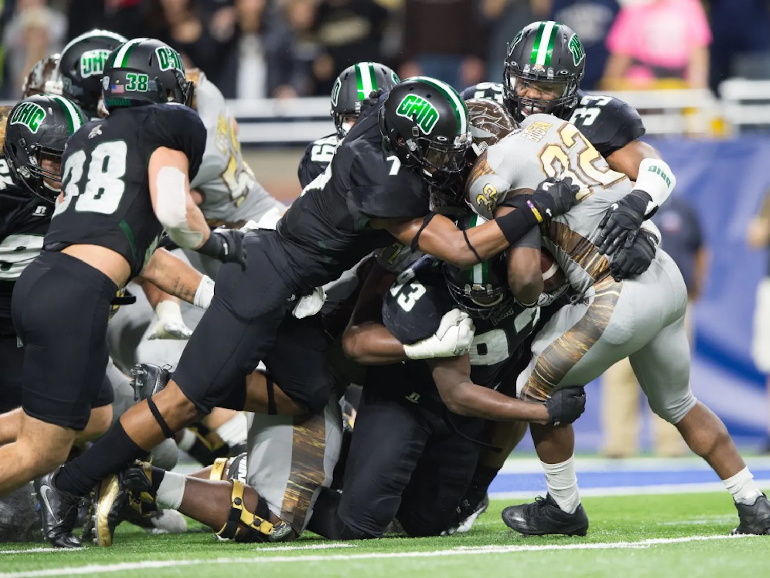 Tarell Basham (93) and Javon Hagan (7) make a goal- line stop against Western Michigan on Ford Field in Detroit Friday night MATT STARKEY|STAFF PHOTOGRAPHER