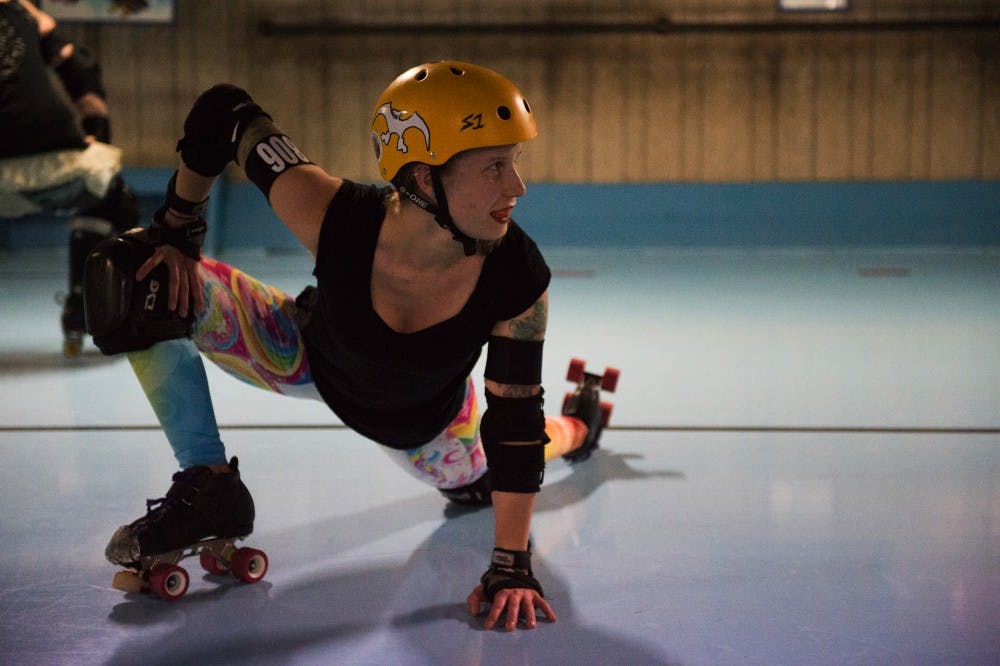 Birde Blackhart, also know as Babz Jewell, stretches during practice at Dow's Rollarena in Nelsonville on January 17th, 2017. (MATT STARKEY|STAFF PHOTOGRAPHER)