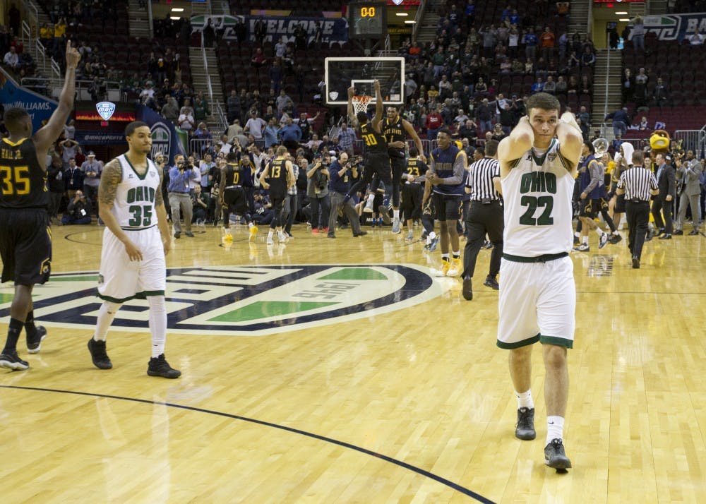 Ohio sophomore forward Gavin Block (#22) and sophomore guard Jordan Dartis (#35) walk off the court after losing to Kent State 68-66 in the MAC Tournament semifinals on Friday, March 10, 2017.