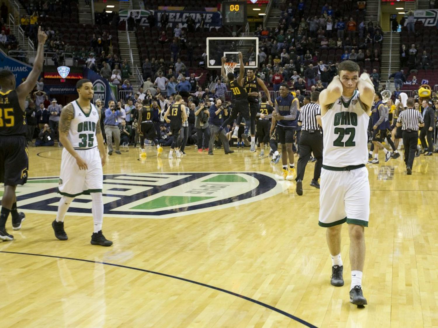 Ohio sophomore forward Gavin Block (#22) and sophomore guard Jordan Dartis (#35) walk off the court after losing to Kent State 68-66 in the MAC Tournament semifinals on Friday, March 10, 2017.
