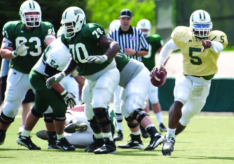 Football: Green, white tussle tomorrow  