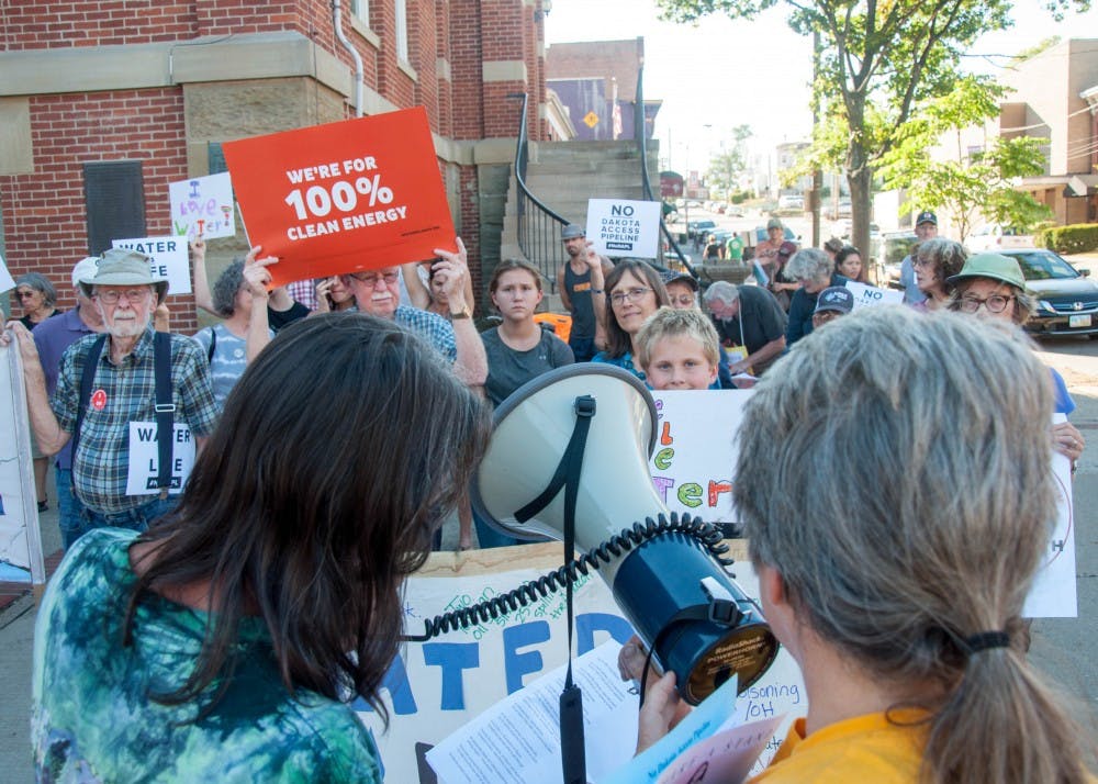 Activists protesting the Dakota Access Pipeline gather in front of the Athens County Courthouse on Tuesday afternoon.