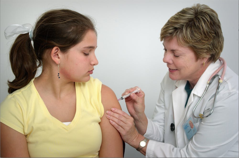 Girl receives vaccination  