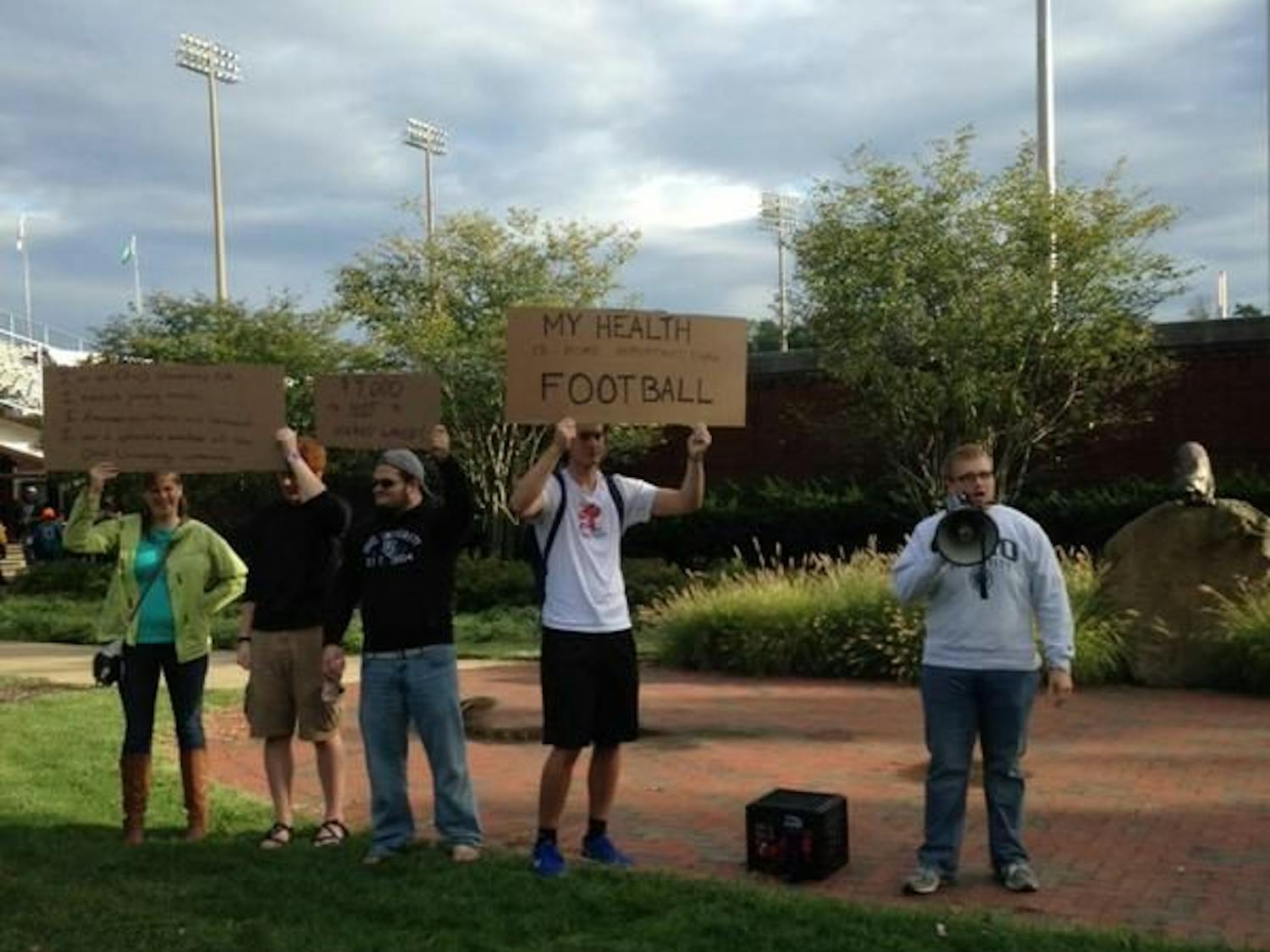 Ohio University graduate students protest at football game  