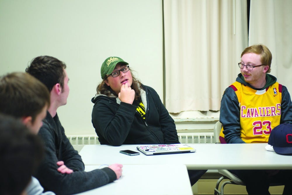 Jacob Koval, left, and Tim Slocombe, right, discuss the Gary Johnson campaign during a Students for Liberty meeting on October 25. (LIAM DAVIS | FOR THE POST)