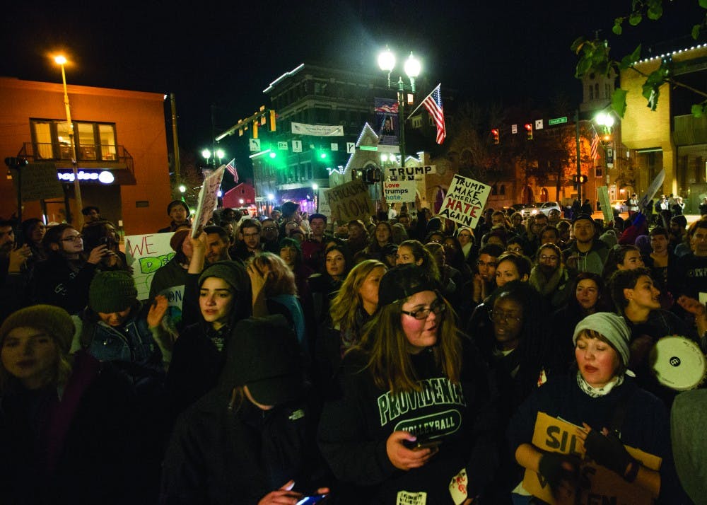 Protestors line up outside of the Athens County Courthouse on Court Street during an anti-Trump rally on Sunday, November 13.