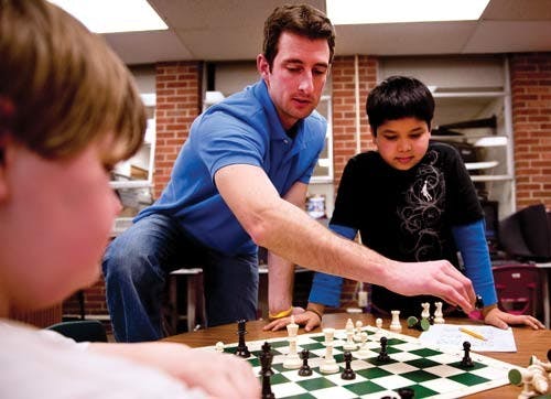 OU students teach elementary chess to rookies  