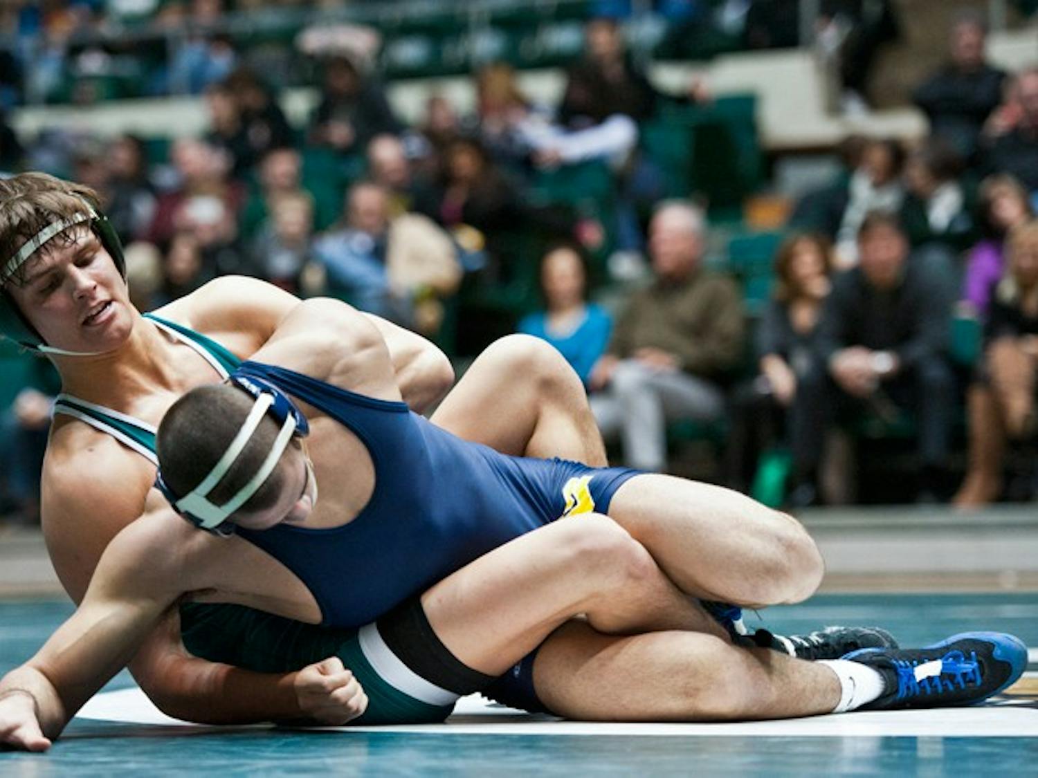 Wrestling: 'Cats wrestle 2 wins out of 3 weekend road matches  