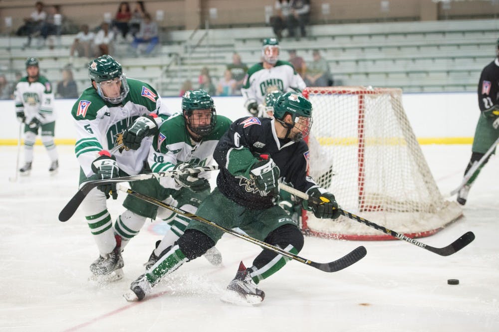Gianni Evengelisti (6) pivots around the white teams goal in Bird Arena Friday night MATT STARKEY|FOR THE POST