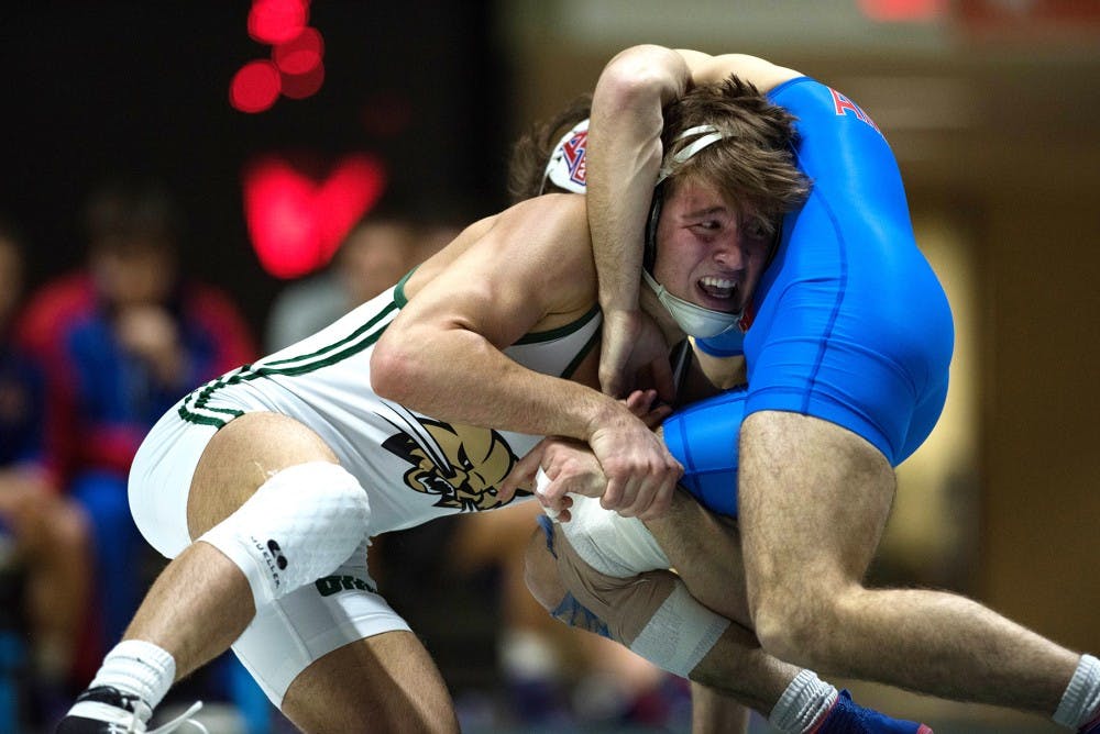 Cameron Kelly wrestles with American University's Esteban Gomez-Rivera (BLAKE NISSEN | FOR THE POST)