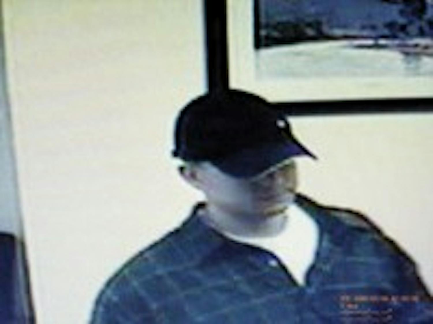 Athens bank robbery suspect at large  