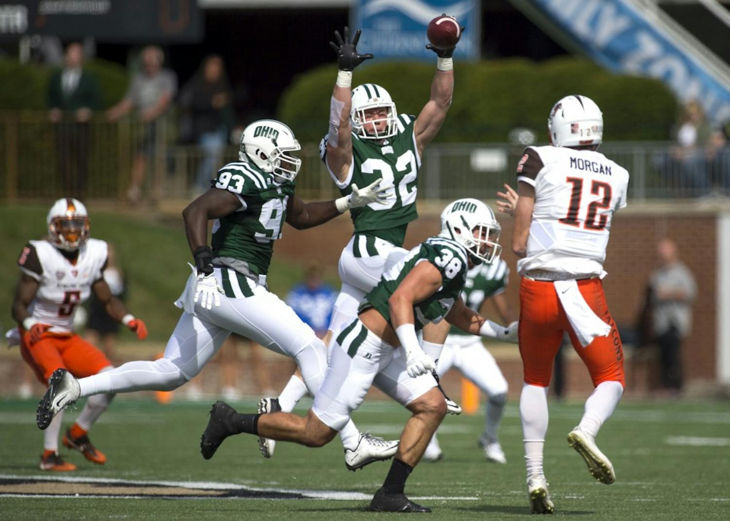 Ohio redshirt junior linebacker Quentin Poling (#32) jumps to block a pass from Bowling Green redshirt freshman quarterback James Morgan during the first quarter of Ohio's 30-24 Homecoming Weekend win, their first win over Bowling Green since 2011. 