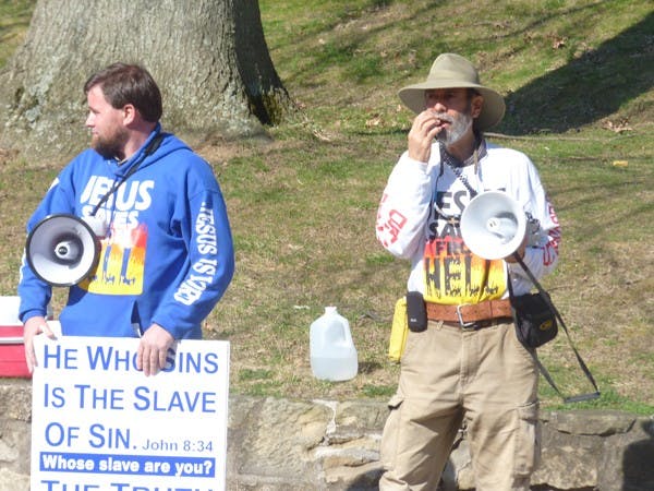 Dueling protestors draw crowd outside of Baker  