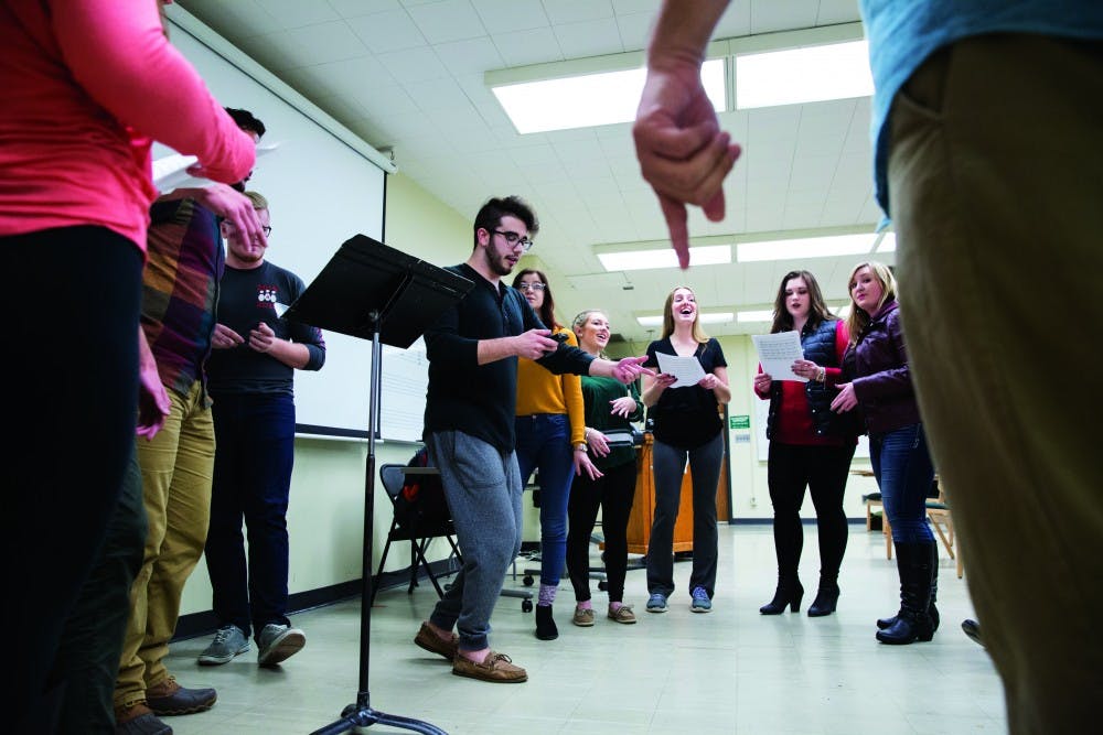 Members of New Chords Acapella group practice on Tuesday evening in Glidden Hall. (LIZ MOUGHON | PHOTO EDITOR)