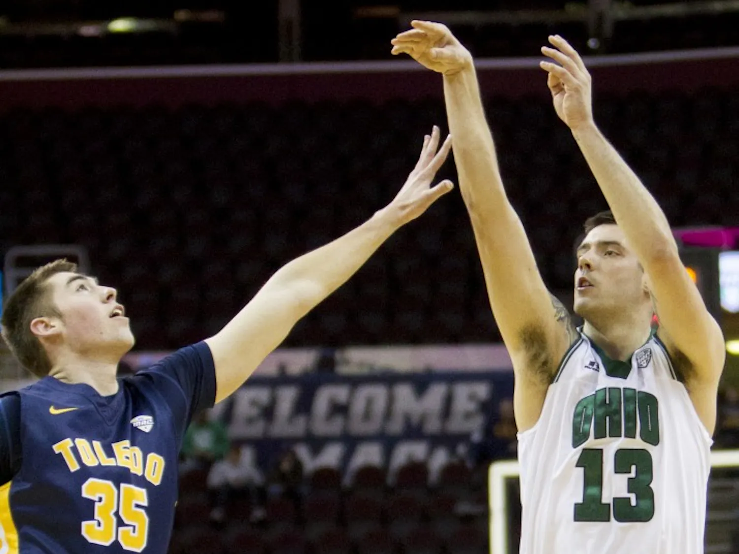 Ohio redshirt senior forward Kenny Kaminski (#13) puts up a shot over Toledo sophomore forward Nate Navigato (#35) during the first half of the Bobcat's comeback win over the Rockets on Thursday, March 9, 2017.