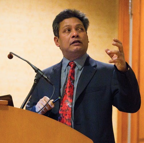 OU professor smashes atoms, molecules together in lecture  