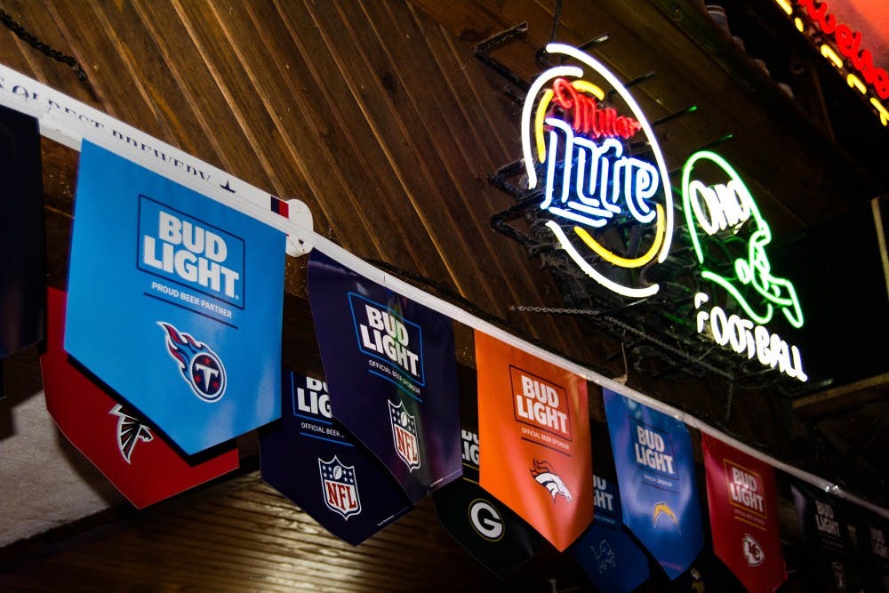 NFL Team flags sponsored by Bud Light have been stolen from inside The Crystal located at 34 N Court Street. (ALIE SKOWRONSKI | FOR THE POST)
