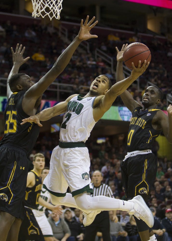 Ohio redshirt junior guard Jaaron Simmons (#2) goes up for a layup around two Kent State defenders during the second half of the Bobcat's 68-66 loss in the MAC Tournament semifinals. 
