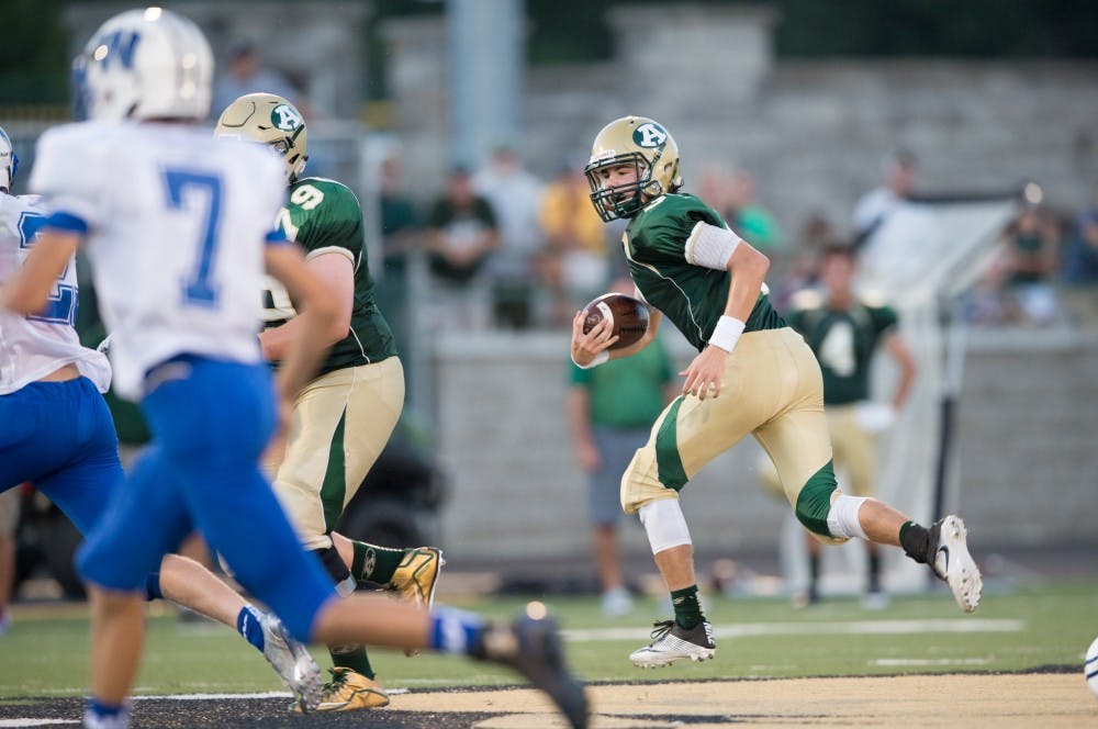 Quarterback Treyce Albin (3) scrambles for extra yards in R. Basil Rutter Field on August 26th 2016 MATT STARKEY|FOR THE POST