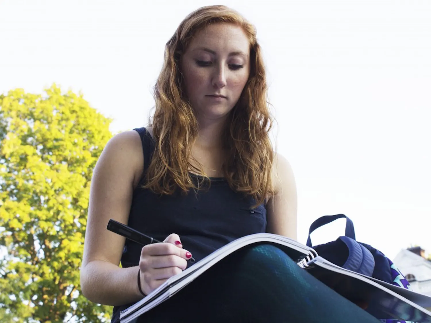Maddie Knostman, a freshman studying visual communications with dyxlexia, writing notes. Knostman was diagniosed her sophmore year of highschool. (LAILA RIAZ | FOR THE POST)