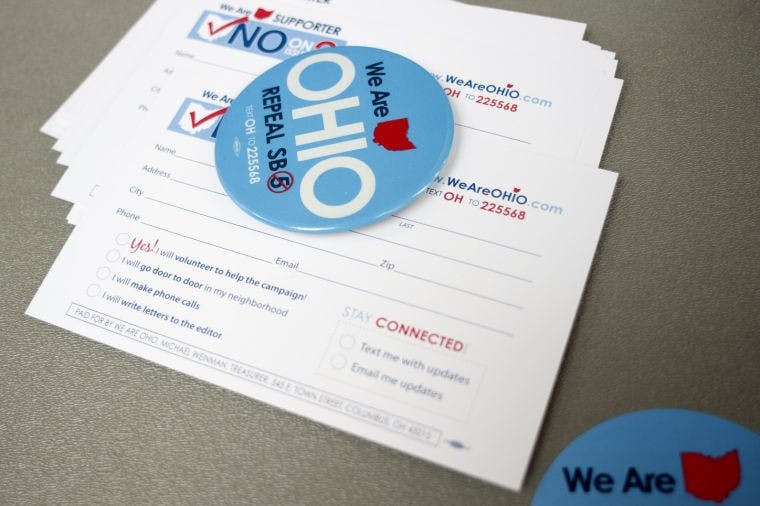 Students stump for Issue 2 outside of Baker  