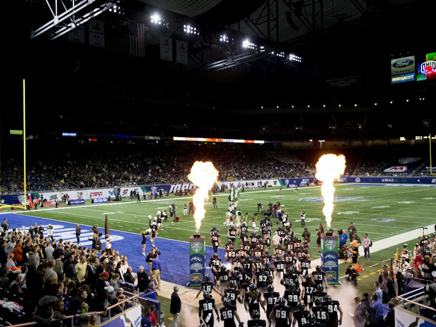 The Ohio Bobcats run out onto Ford Field before the start of the MAC Championship game against Western Michigan. A late Bronco interception sealed a 29-23 loss for Ohio.
