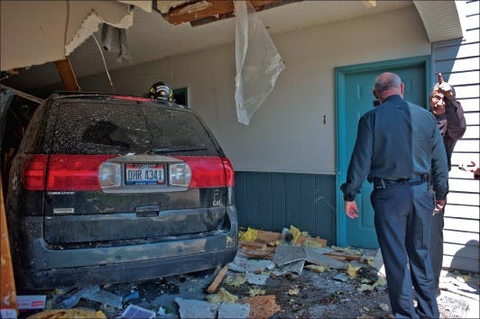 Car careens into complex  