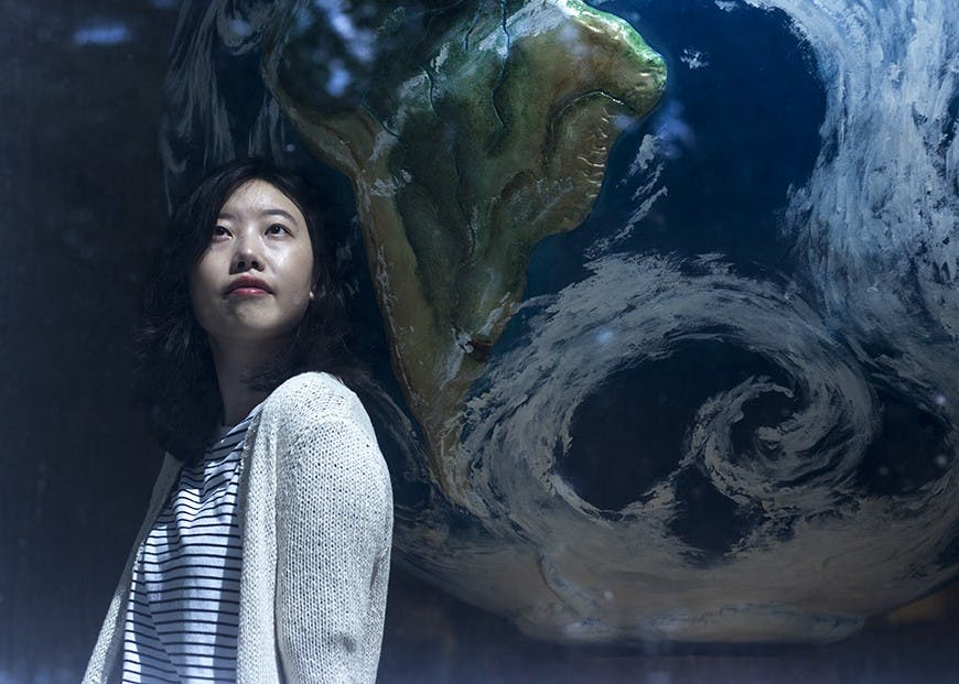 Yvonne Yen, a senior studying strategic communications, poses for a portrait in Schoonover Center on College Green in Athens, Ohio. (HANNAH SCHROEDER | FOR THE POST)