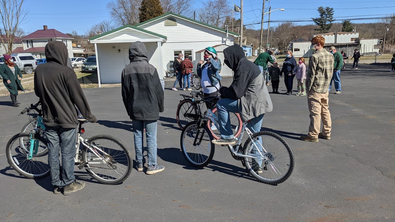 Re-Cycle - Chauncey residents with new-to-them bicycles in the Senior Center parking lot.jpg