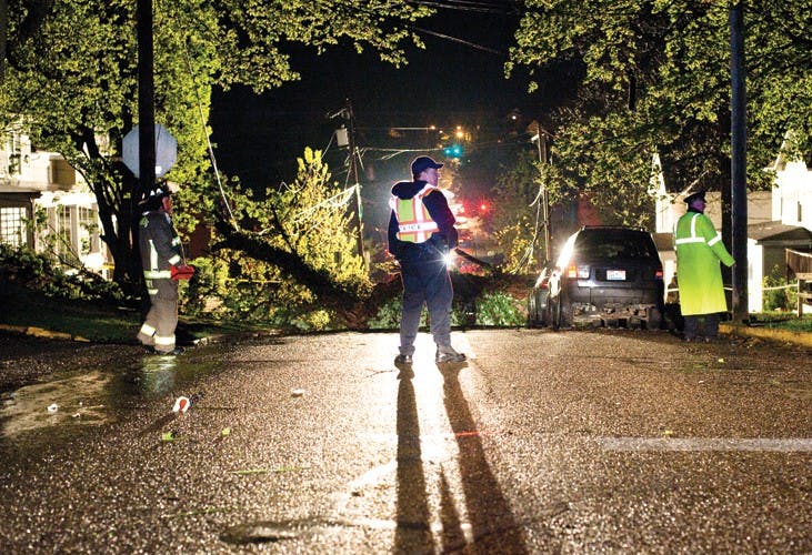 Tree causes outages, crushes car  