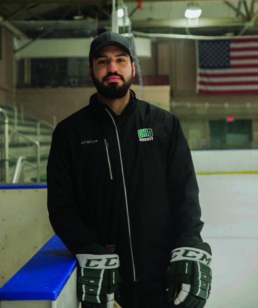 Assistant coach Nathan De La Torre poses for a portrait after practice on January 31, 2017. De La Torre has transitioned from being a player to a coach for the same team. 