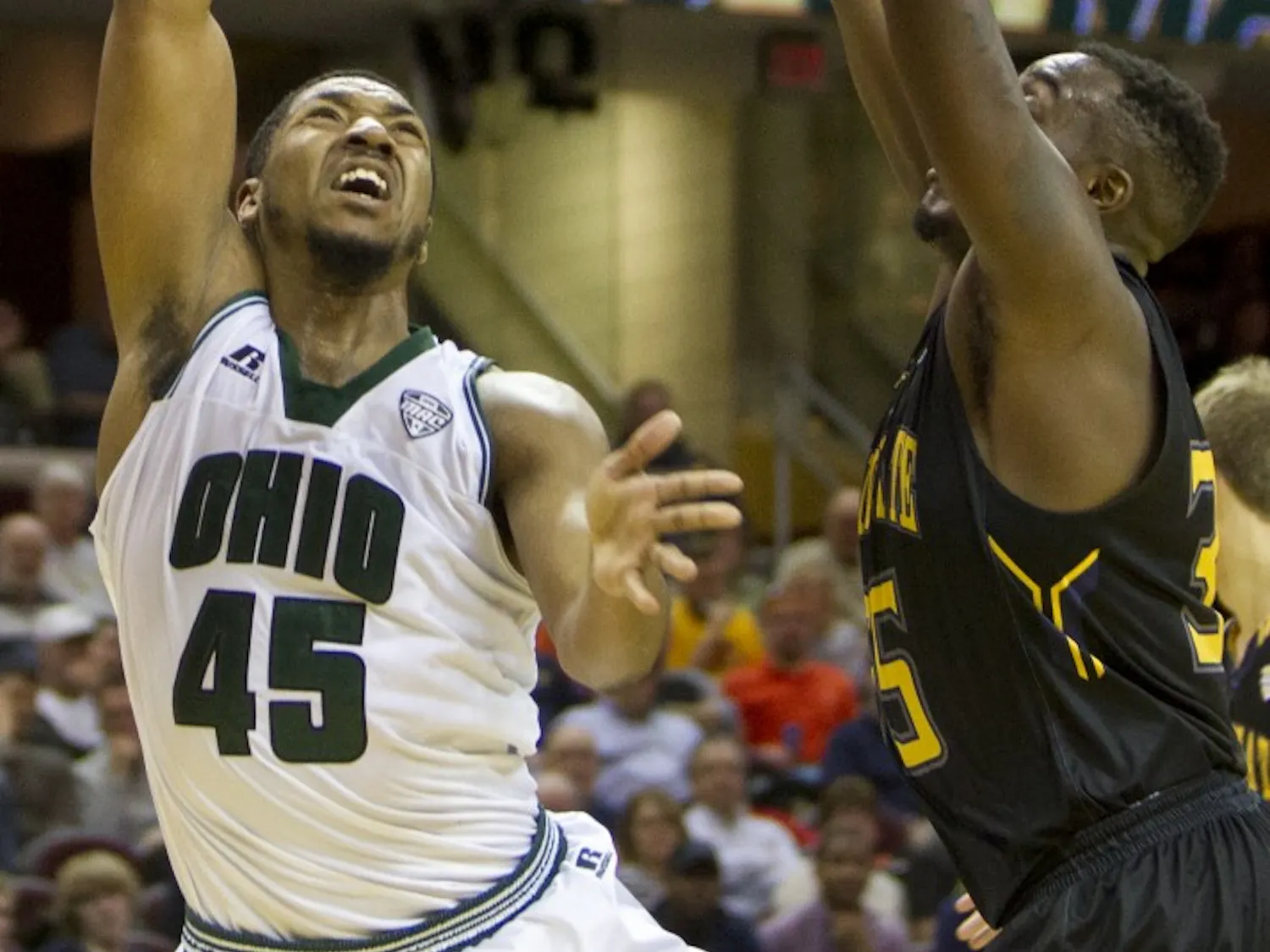Ohio sophomore forward Doug Taylor (#45) puts up a shot over a Kent State defender during the second half of the Bobcat's 68-66 loss on Friday, March 10, 2017. Taylor finished with eight points off the bench.