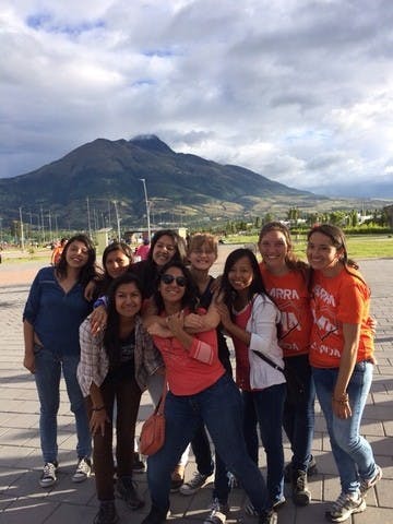 Lauren Farnsworth, center, poses with friends she made during her gap year in Ecuador