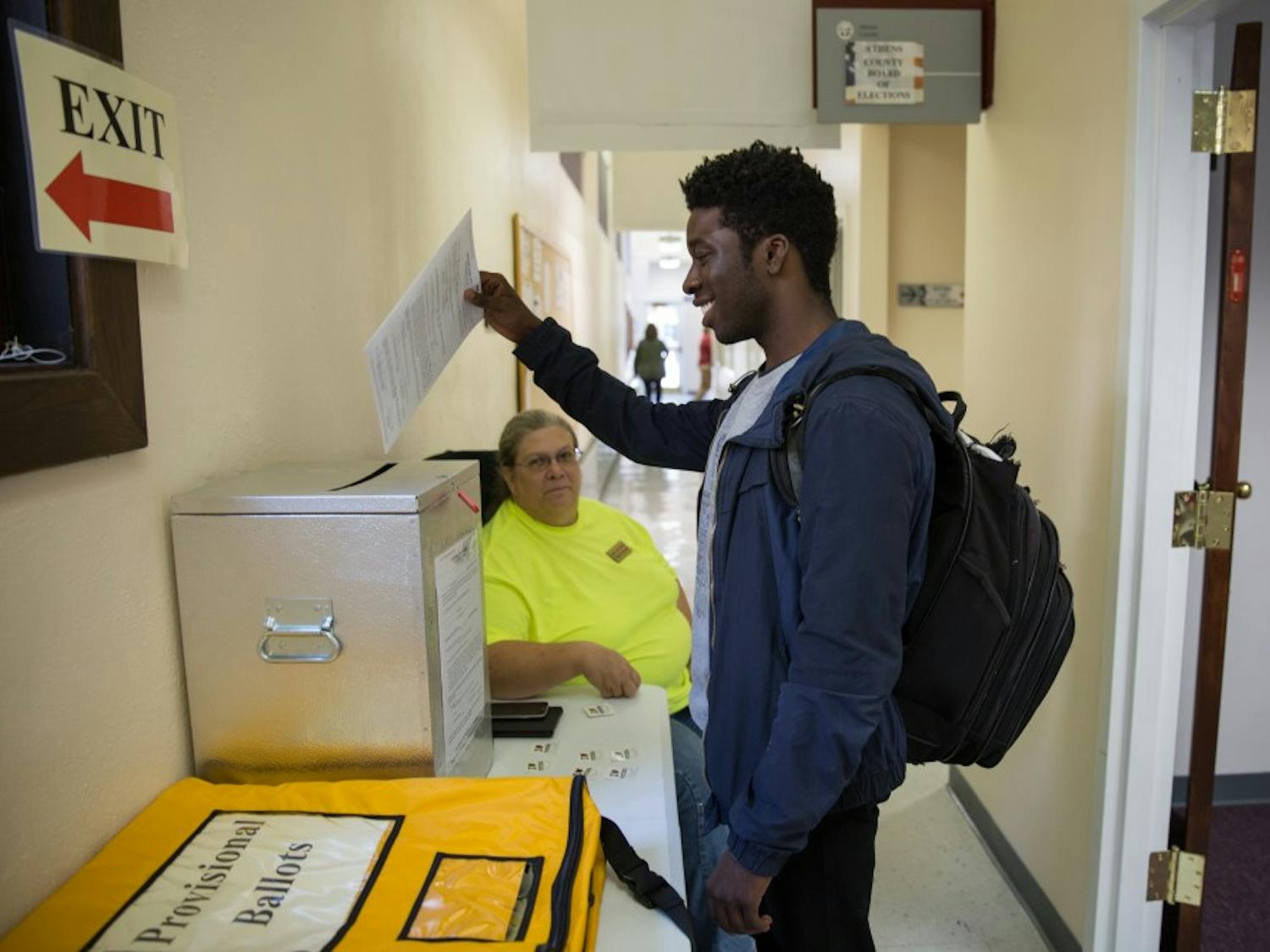 Austin Rivers, a senior from South Carolina, drops his vote in the ballot box on Tuesday. (LIZ MOUGHON | PHOTO EDITOR)