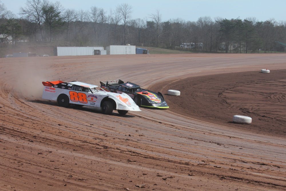 Late-Model drivers Brandon Francis (88) and Zach Milbee (5) race through the third turn at Skyline Speedway.