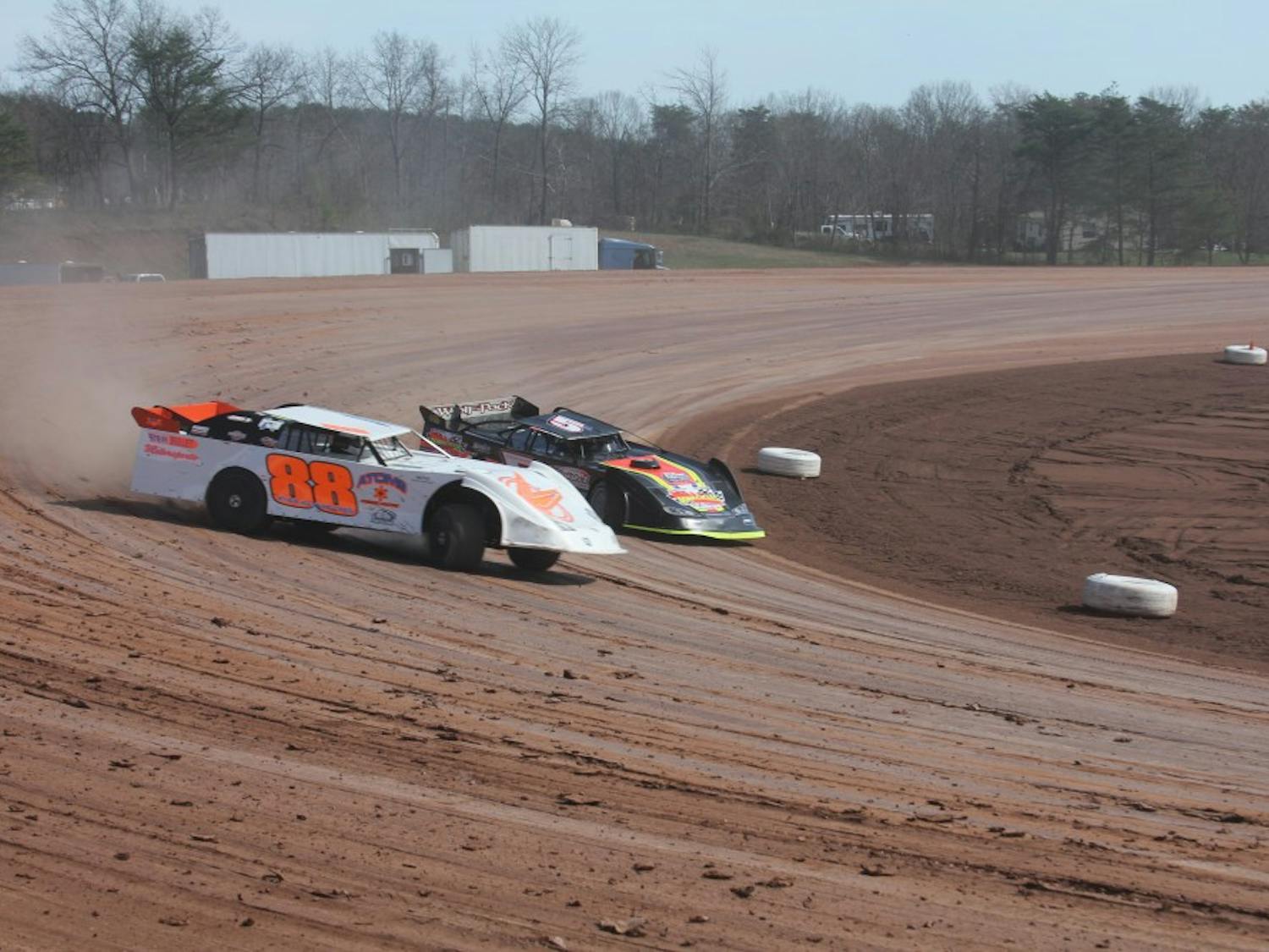 Late-Model drivers Brandon Francis (88) and Zach Milbee (5) race through the third turn at Skyline Speedway.