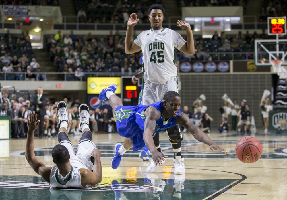 Florida Gulf Coast redshirt freshman guard Zach Johnson (#5) dives for the ball after colliding with Ohio redshirt sophomore guard Jaaron Simmons (#2) in the second half oh Ohio's 85-75 win on Saturday. (CARL FONTICELLA | FOR THE POST) 