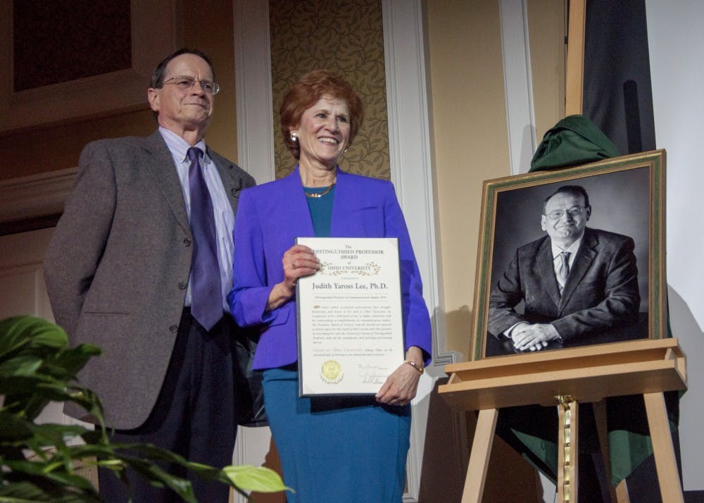 Ohio University interim president Dr. David Descutner stands with Dr. Judith Yaross Lee in Baker Ballroom during the Distinguished Professor Award ceremony on February 20, 2017. 