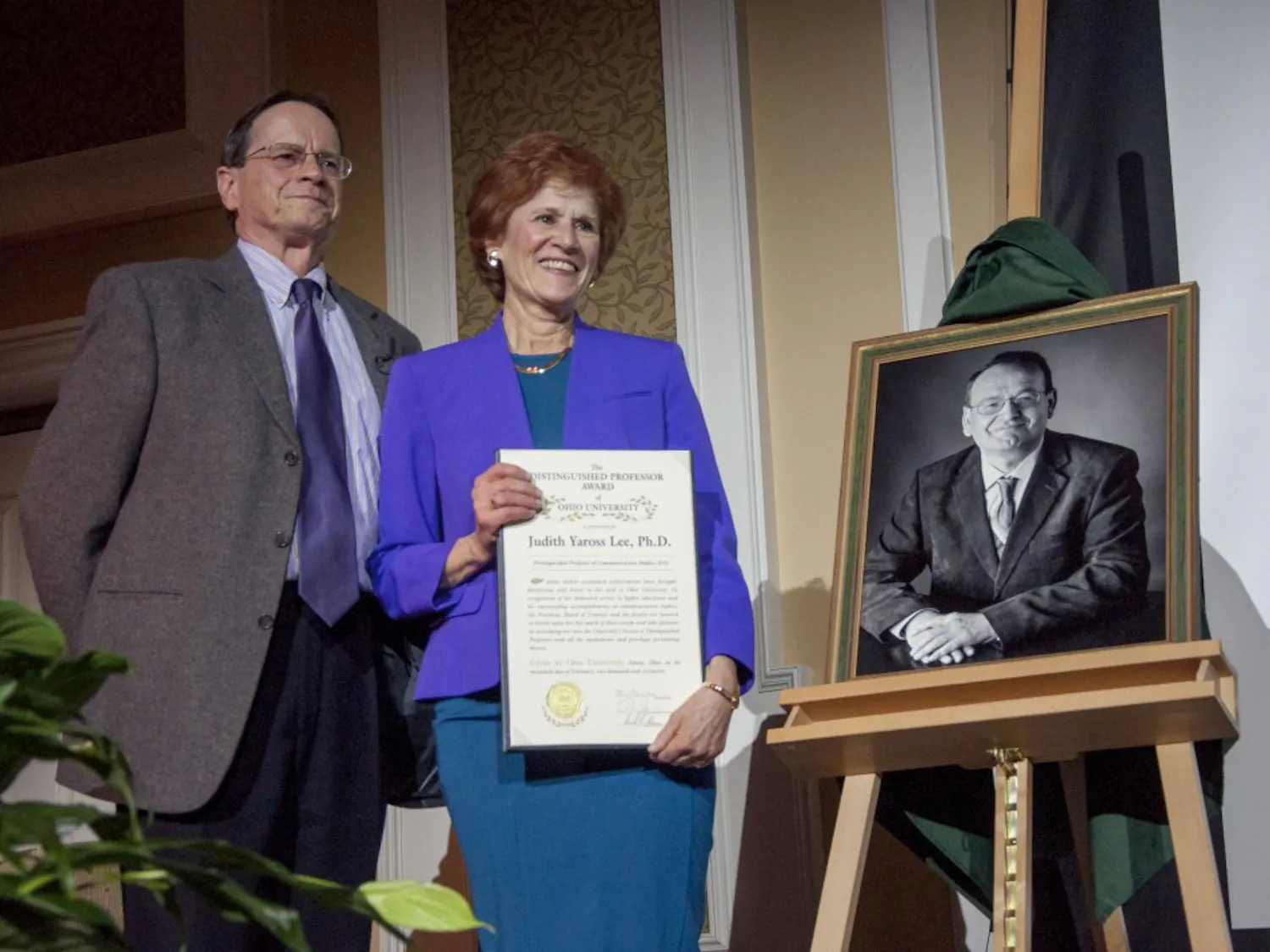 Ohio University interim president Dr. David Descutner stands with Dr. Judith Yaross Lee in Baker Ballroom during the Distinguished Professor Award ceremony on February 20, 2017.