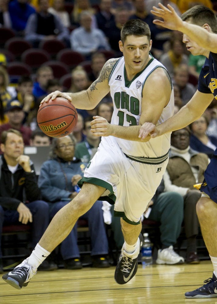 Ohio redshirt senior forward Kenny Kaminski (#13) drives past a Toledo defender during the first half of the Bobcat's come-from-behind 67-66 win over Toledo on Thursday, March 9, 2017. Kaminski hit a shot from the key with seven seconds left for his second game-winning shot of the season. 
