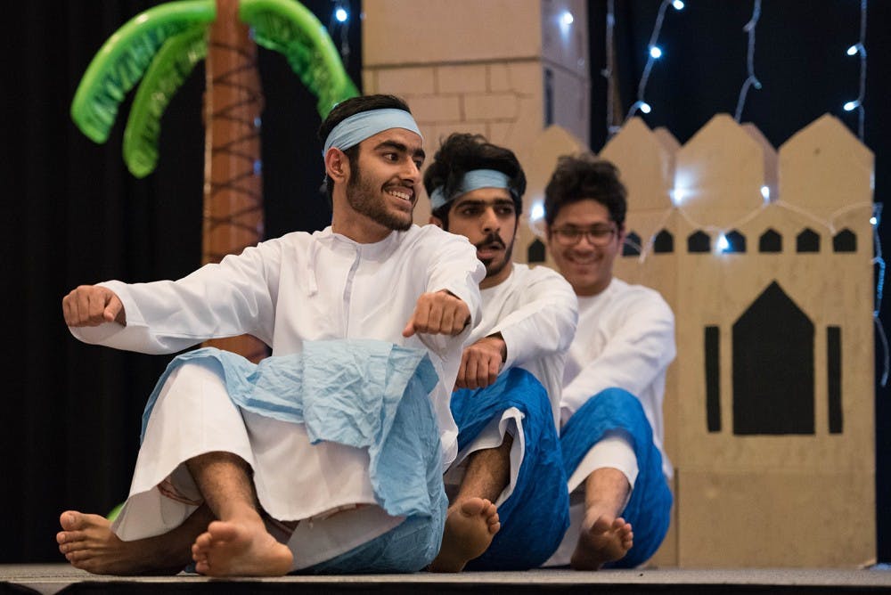 Members of the Arabic Language Student Association perform a traditional dance during Arabian Night in Baker Ballroom on Thursday.