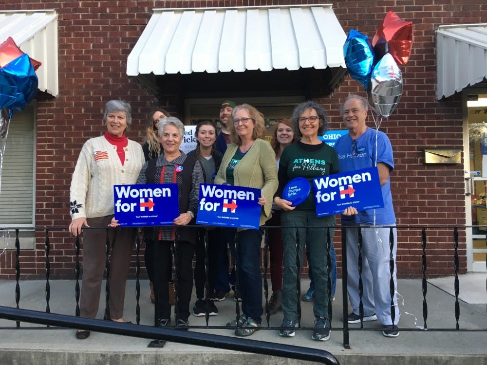 Frances Strickland, left, visits a group of Athens Democratic Party volunteers the evening of Nov. 5, 2016.