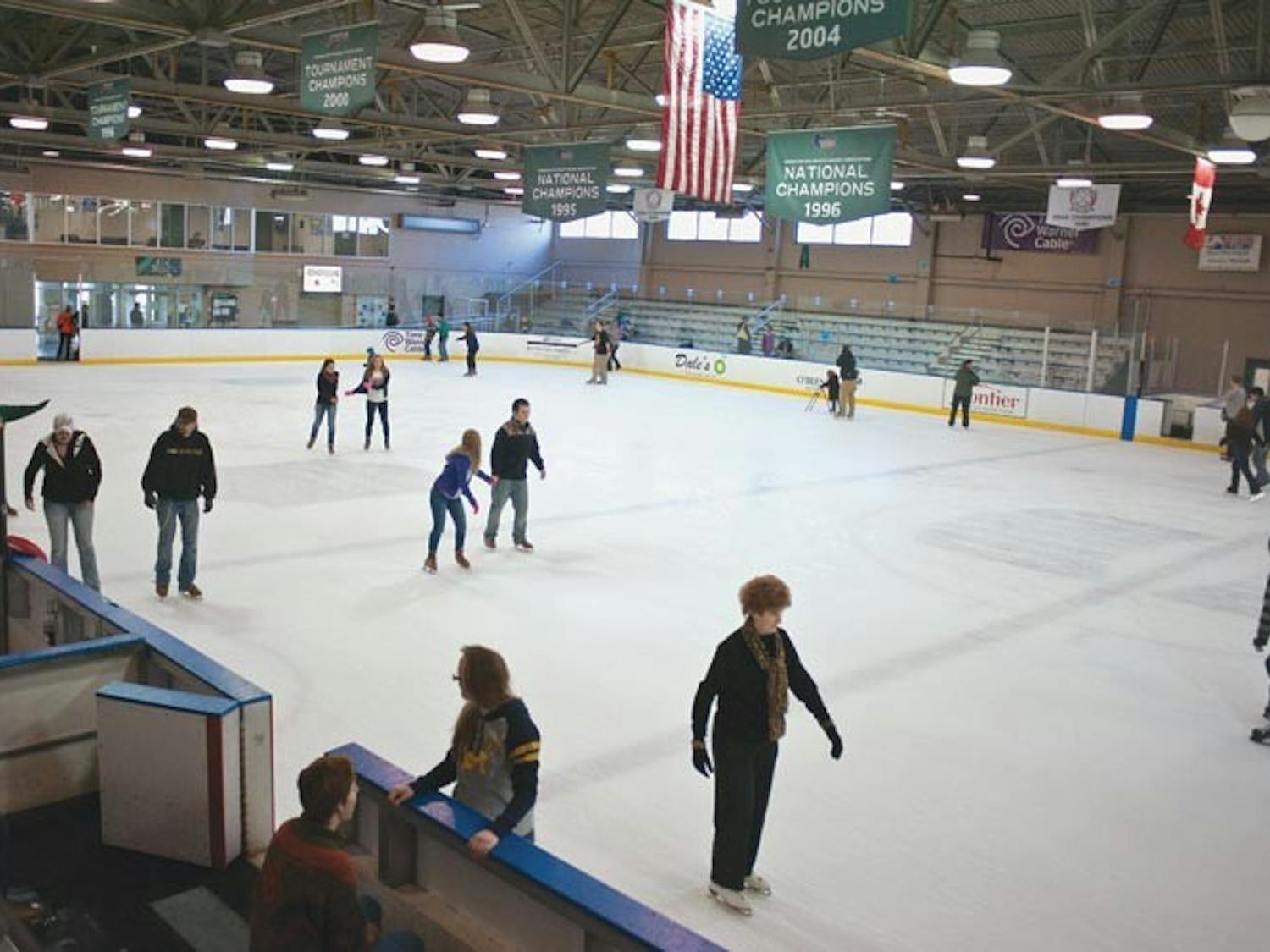Parents and students skate, laugh, dance