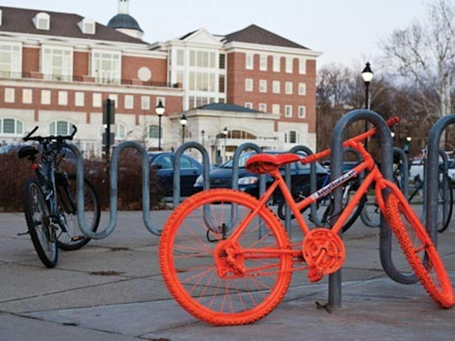 Bright orange bikes peddle local rental agency  