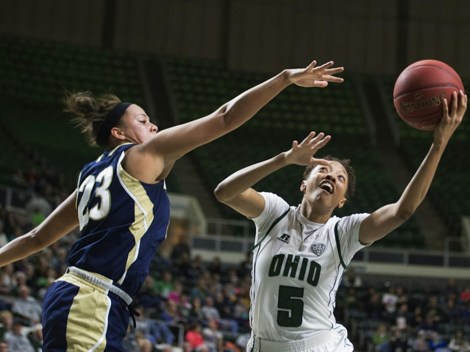 Ohio sophomore guard Quiera Lampkins tries to put up a shot around Akron junior guard DiAndra Gibson during their MAC game at the Convocation Center. (CARL FONTICELLA | FOR THE POST) 