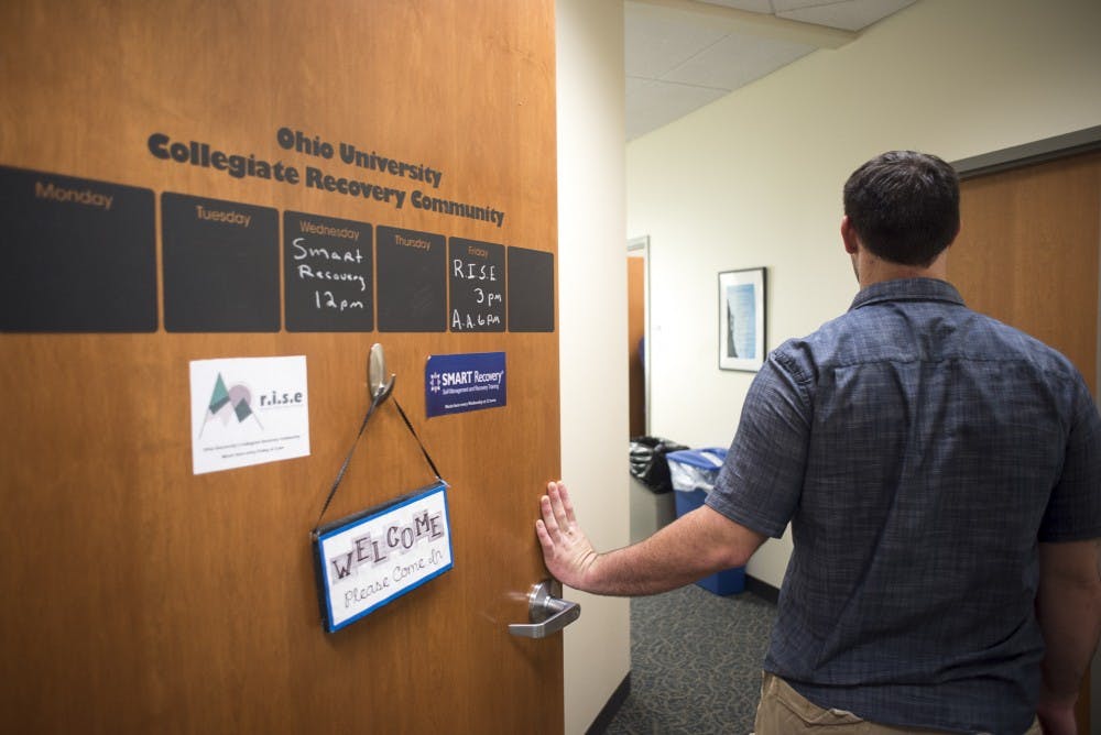 Jimmy Stitt, a 23-year-old studying Critical Studies in Education foundation program, walks into the Recovery Community room in Baker Center on September 23, 2016. (CAMILLE FINE | PHOTO ILLUSTRATION)