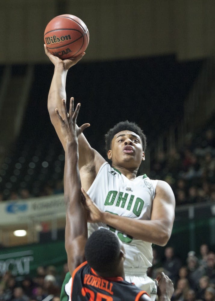 Ohio junior forward Antonio Campbell (#33) puts up a shot against pressure from Bowling Green redshirt freshman forward Rasheed Worrell (#32) during the first half of their game on Tuesday. (CARL FONTICELLA | FOR THE POST) 