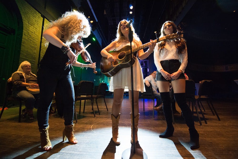 Three Girls Rock Into A Bar