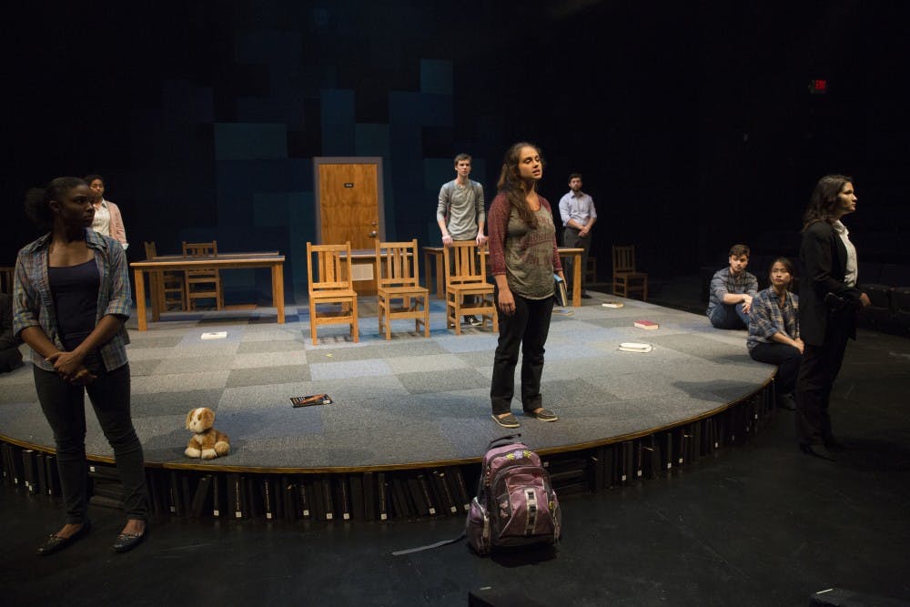 Rachel Gaunce (center) plays the role of Caitlin Gabriel in "The Library" and leads the cast in a drama about the aftermath that follows school shootings in America. Gabriel was accused of assisting the shooter and struggles to redeem her identity. "The Library" is showing in The Forum Theater in RTV this week. (LIZ MOUGHON | FOR THE POST)