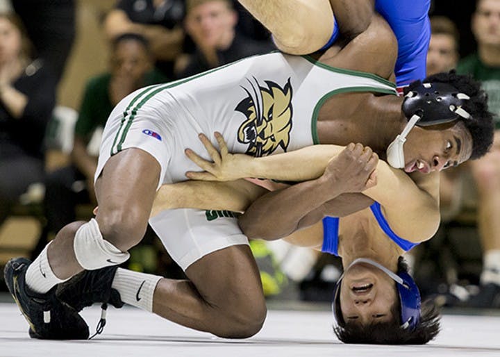 Ohio University's Shakur Laney pins down American University's Josh Terao during Ohio's match Sunday.